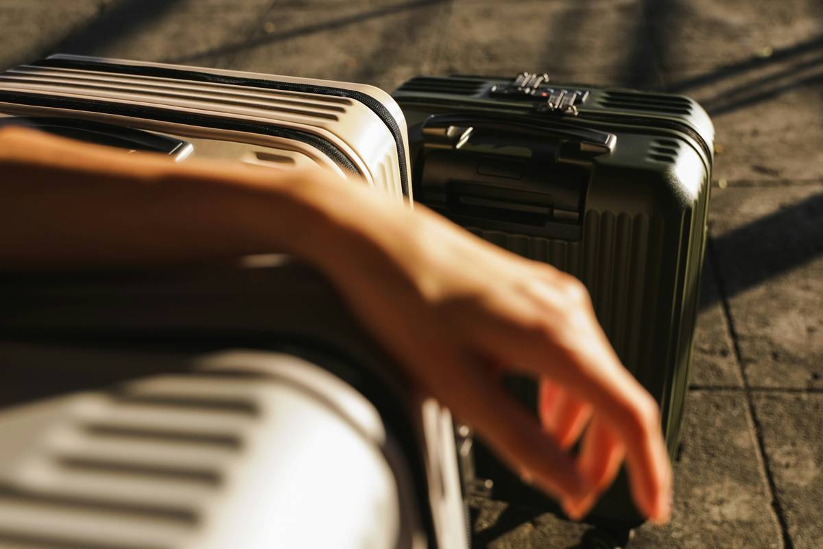 Traveler buying essentials at airport store using Temporary Replacement Funds